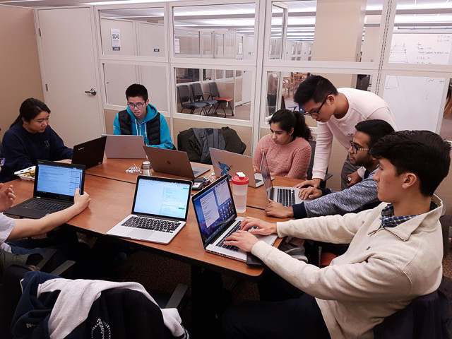 Students collaborate as part of the Hack4Impact chapter at the University. The organization helps connect students with nonprofits through technology