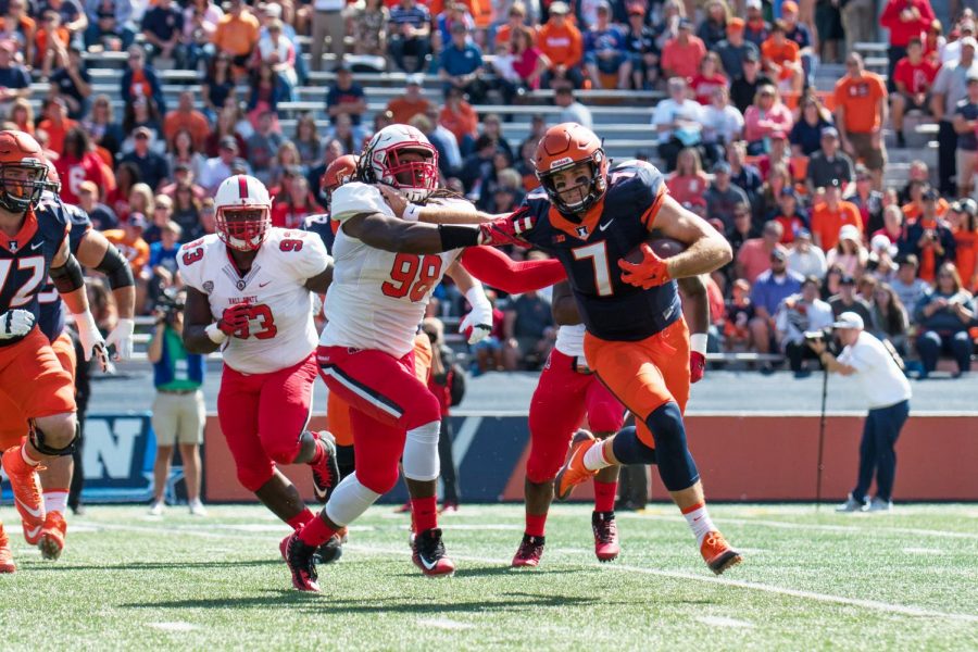 Illinois quarterback Chayce Crouch rolls out of the pocket during the game against Ball State on Saturday, September 2, at Memorial Stadium.