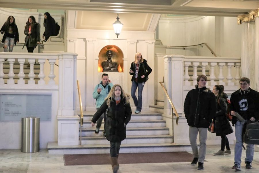 Students walk down the stairs in Lincoln Hall on Tuesday. 