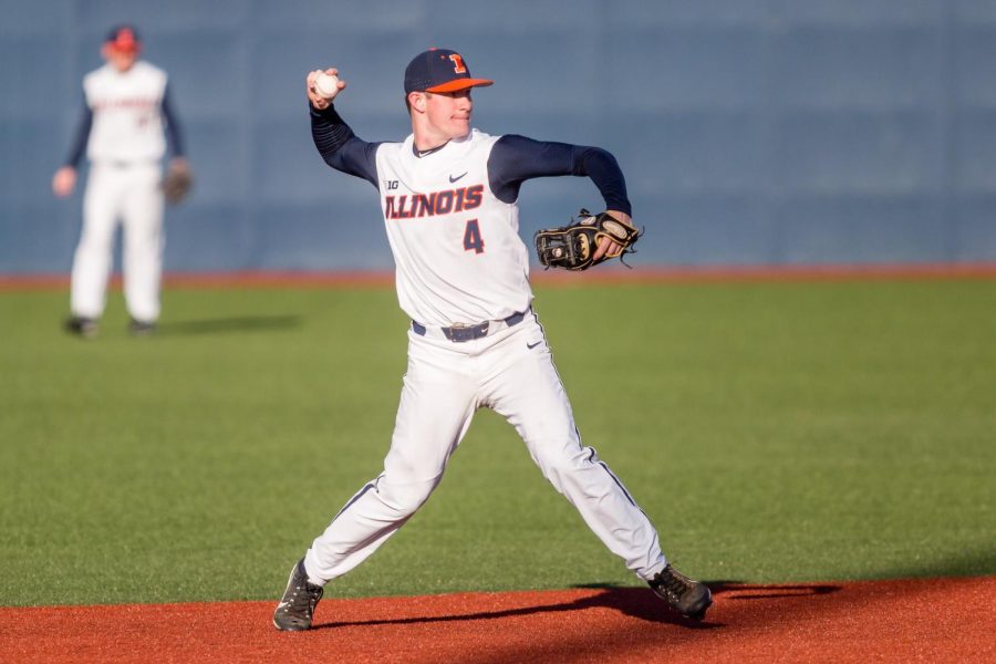 Illinois shortstop Ben Troike makes a throw to first during the game against Milwaukee at the Illinois Field on March 14. When playing Northwestern this weekend, Troike made a play that gained him the No. 5 slot on SportsCenter’s Top 10. 