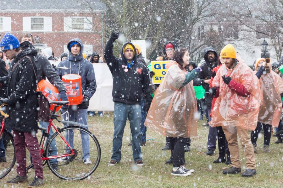 Members of the GEO rally on University President Killeens front lawn on March 6.