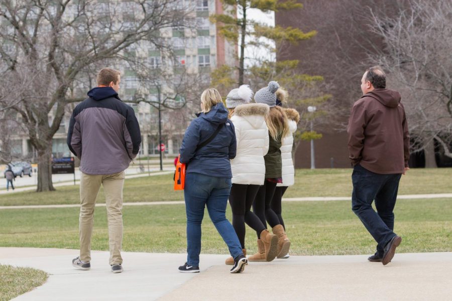 Prospective students touring the campus. Champaign-Urbana has been ranked highly as a place for college students to look for post-graduation living.