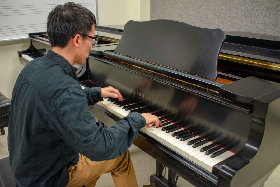 Bowen Song, senior, practices between his classes Thursday at the Music Building. Newly admitted students in the School of Music can now shadow current students.