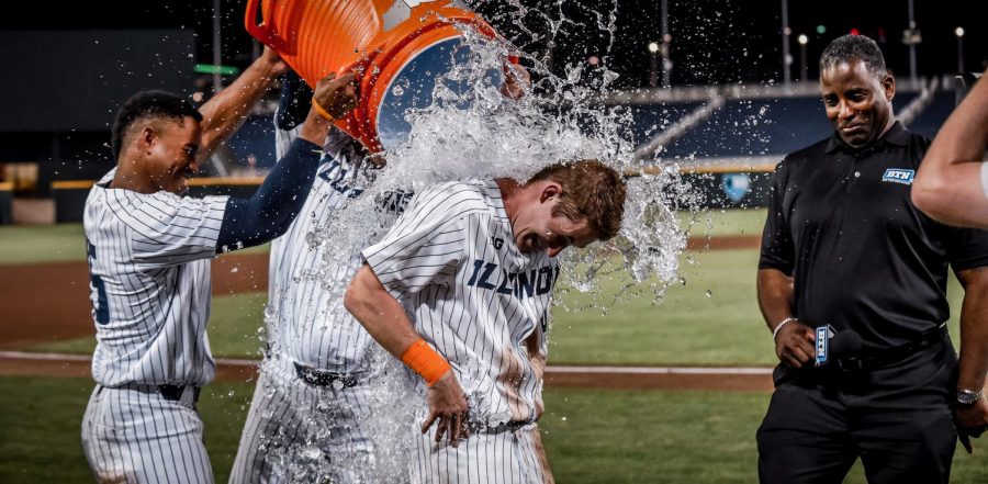 Ben Troike gets a shower from the teams water cooler after hitting a walk-off shot in Illinois Friday night match-up against Indiana. The Illini won 5-4.