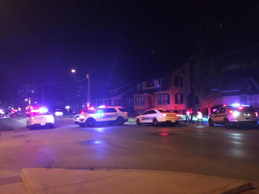 Police cars near the scene of the shooting around 1 a.m. on May 13. A suspect, 20-year-old Devon Cooper from Danville, Illinois, has been arrested by the Champaign Police Department in relation to the case.