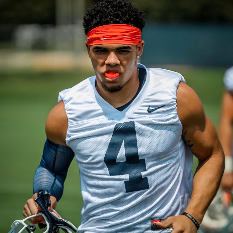 Sophomore defensive back Bennett Williams warms up during Illinois football training camp on Friday. Williams highlights a secondary that heads into the 2018 season with a lot young talent.