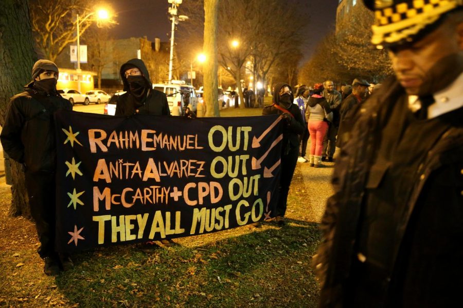 Protesters stand outside of the CPD headquarters after a monthly board
meeting on Dec. 9, 2015.