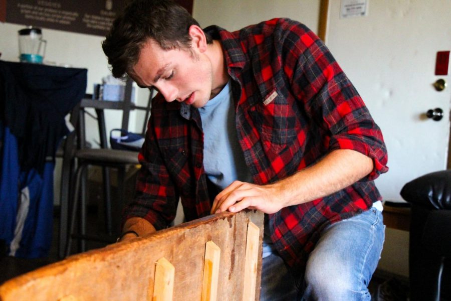 John Bieber, junior in ACES, builds furnitures for friends and family at his apartment on Tuesday. In recent years, he began commission work and uses his apartment on campus as a temporary
studio while working on the main pieces at his house in the suburbs.