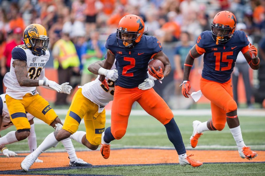 Illinois running back Reggie Corbin shakes off a defender during the game against Kent State at Memorial Stadium on Saturday. Corbin looks to be a big part of
this year’s offense.
