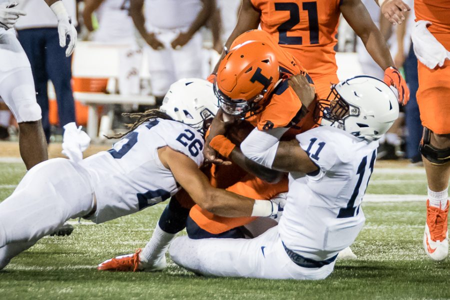 Illinois quarterback M.J. Rivers gets tackled during the game against Penn State at Memorial Stadium on Sept. 21. Rivers will enter the transfer portal for the upcoming season, leaving Illinois without a quarterback with starting experience.