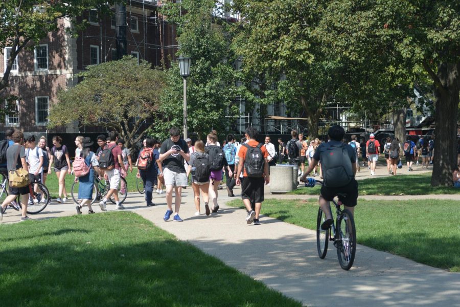 Students walk to and from class on the Main Quad in Urbana, Illinois.