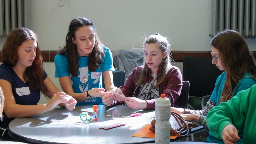 Collen Robicheaux works with girls on Sonia Math Day in fall 2017. The event is aimed toward promoting equal opportunity and treatment of women in the field of mathematics. 