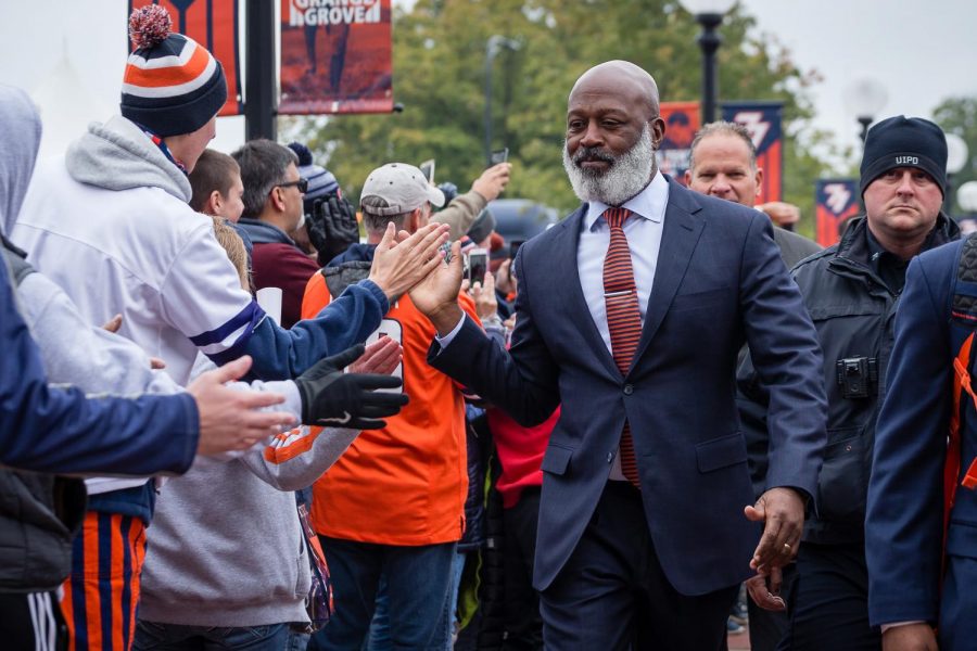 Illinois+head+coach+Lovie+Smith+shakes+hands+with+fans+along+Grange+Grove+before+the+game+against+Purdue+at+Memorial+Stadium+on+Saturday%2C+Oct.+13%2C+2018.