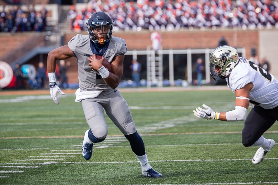 Illinois quarterback AJ Bush (1) rushes the ball for a touchdown during the game against Purdue at Memorial Stadium on Saturday, Oct. 13, 2018.