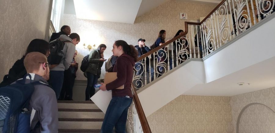Voters line up the stairs at the Illini Union polling location around noon.