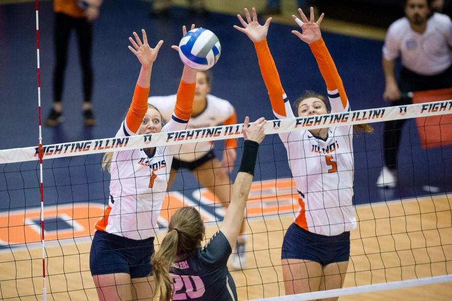 Illinois+setter+Jordyn+Poulter+%281%29+and+middle+blocker+Ali+Bastianelli+%285%29+try+to+block+the+ball+during+the+match+against+Purdue+at+Huff+Hall+on+Saturday%2C+Nov.+24%2C+2018.