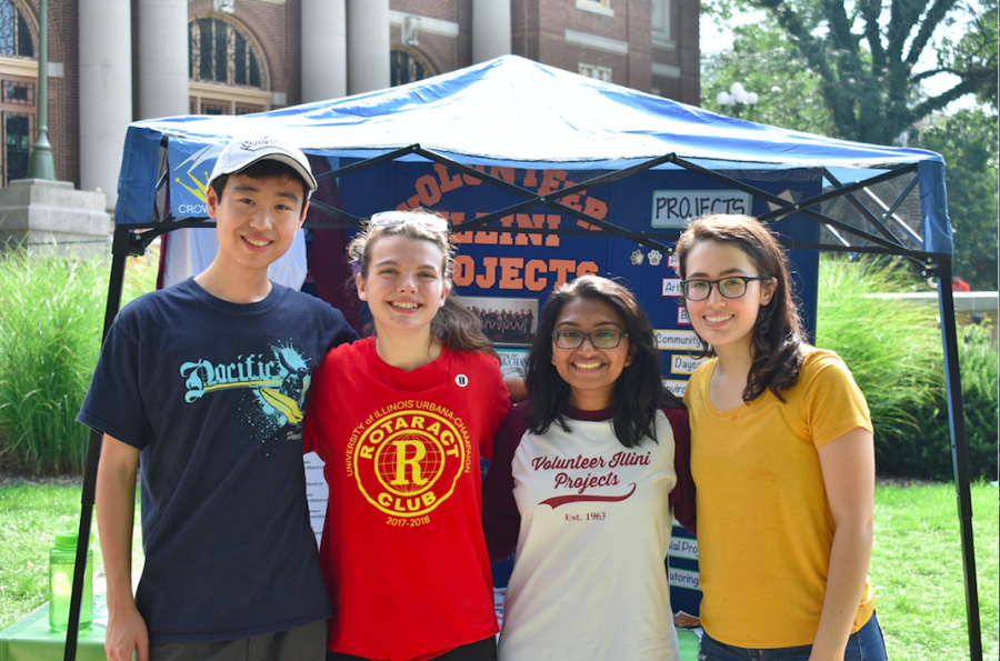 David Cao, Marley Majetic, Sara Babo and Adrianna Velasco, members of the student organization Volunteer Illini Projects, pose for a photo in front of their promotional booth on last year’s Quad Day.