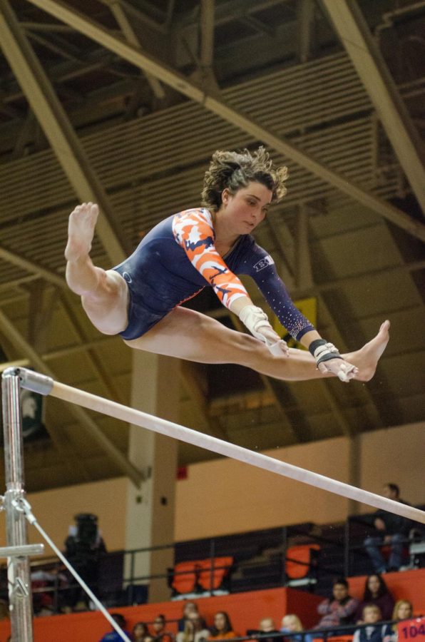 Rae Balthazor performs her bars routine during Illinois’ meet against Michigan on Jan. 19, 2018. Illinois lost to Michigan 194.325 to 194.975.