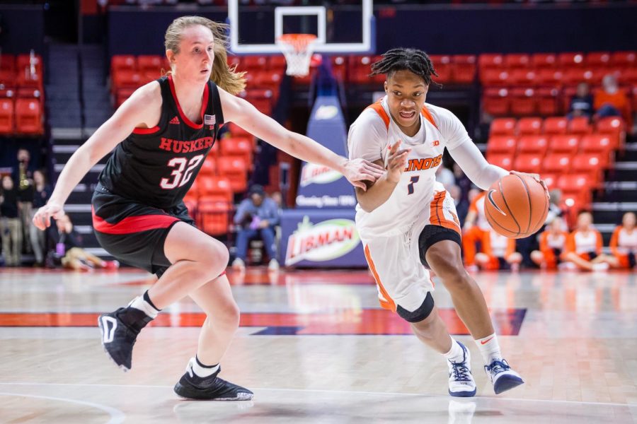 Illinois guard Brandi Beasley drives to the basket during the game against Nebraska at the State Farm Center on Thursday. The Illini lost 77-67. 