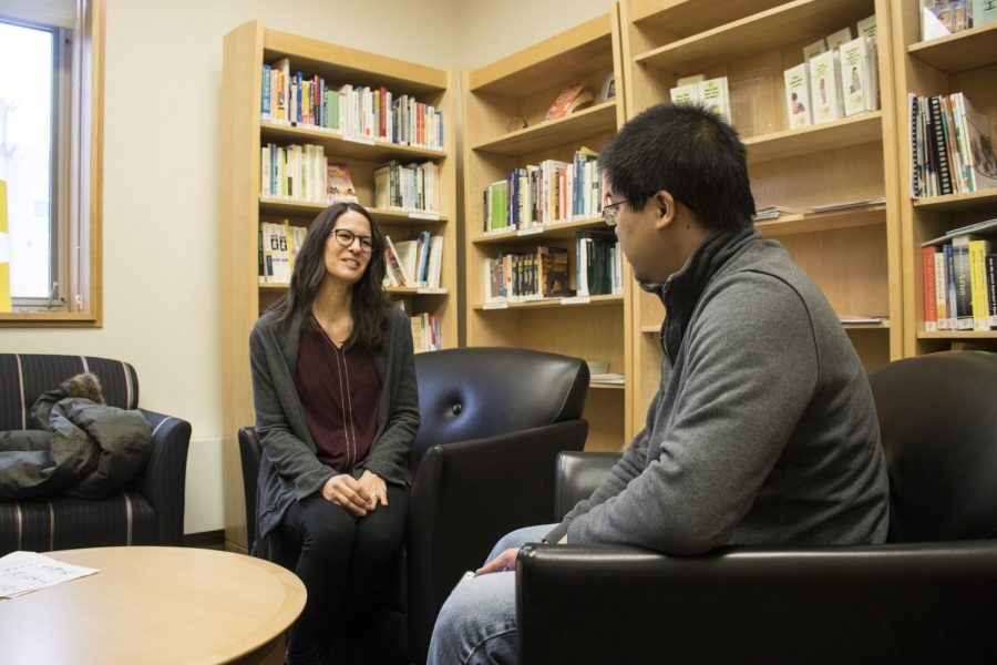Jeanne Kramer (left), an employee of the new Microsoft Lighthouse Initiative, speaks with participant, Ethan Chew (right), at Christopher Hall.