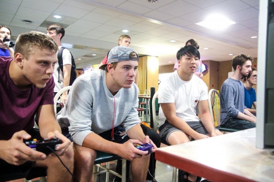 Students Wesley Blodig, Kyle Biedron and Bernard Chan play Super Smash Brothers Melee for the Nintendo Gamecube in the basement of the Illini Union on Oct. 5.