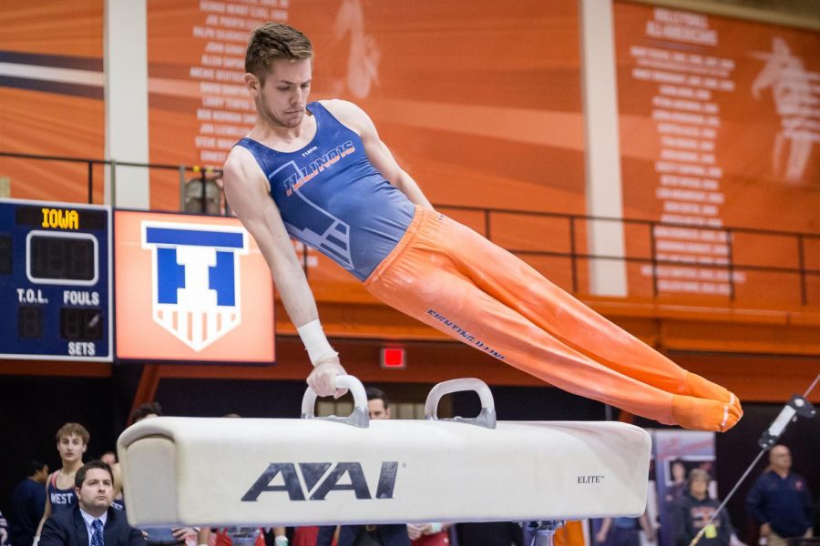 Illinois’ Michael Paradise performs on the pommel horse during the meet against Iowa at Huff Hall on Jan. 26. The Illini won 410.450-398.800.