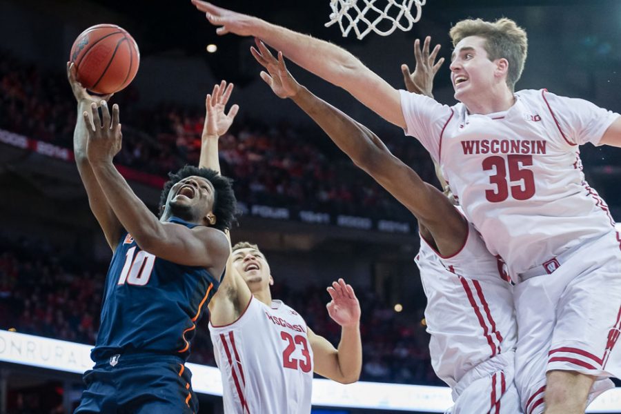 Illinois guard Andres Feliz attempts to put up a layup during the game against Wisconsin at the Kohl Center in Madison, Wisconsin, on Monday. The Illini lost 58-64, snapping the teams longest win streak in the Brad Underwood era.