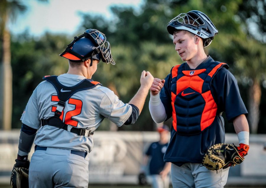 David Craan and teammates celebrate a victory against Florida Atlantic over the weekend. The
Illini took all three games of the series for a 6-0 start to the season.
