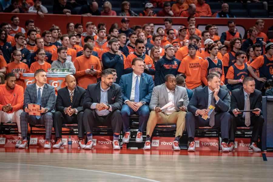 Head coach Brad Underwood and other assistant coaches wear sneakers with their formal attire to promote cancer research and awareness on Jan. 23. The
Coaches vs. Cancer 3-Point Challenge was created by the American Cancer Society and the National Association of Basketball Coaches.