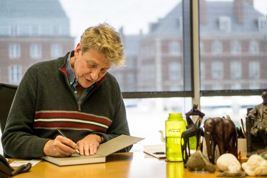 Professor Bruce Fouke works in his office at the Carl Woese Institute of Genomic Biology gatehouse on Monday.