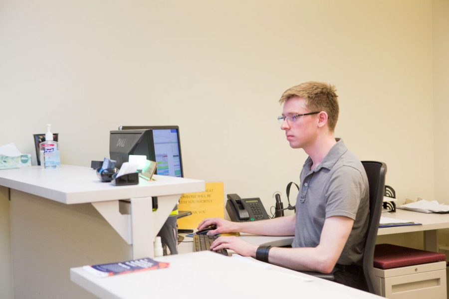 Alex Duvall works as a receptionist at the Campus Center for Advising and Academic Services on Wright Street, where students in the Division of General Studies seek advising. DGS offers a tool to help students narrow down different majors. 