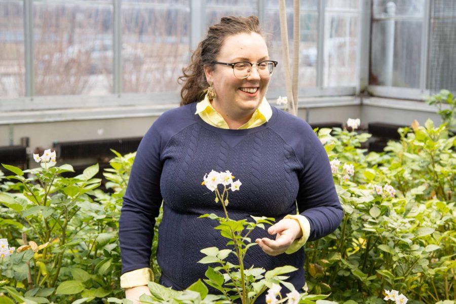 Amanda Cavanagh, a postdoctoral student who helped develop a new method of plant growth in the southernmost greenhouse in the Plant Sciences Laboratory on Friday. The new method currently produces 40 percent more plant growth.