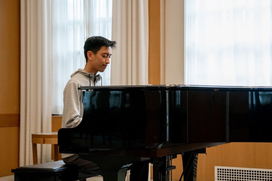 Shoji Moto, sophomore in Engineering, plays the grand piano in the lobby of Lincoln Avenue Residence Hall on Saturday. Moto has been taking piano lessons since he was 4 years old.