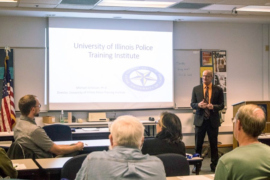 Michael Schlosser, director of the University of Illinois Police Training Institute, opens up his first class of Citizen Police Academy with introductions on April 4.  This 10-week course allows locals to be educated and informed about everything the University of Illinois Police do for the community.