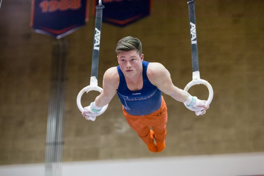 Illinois Alex Diab performs on the still rings during the meet against Iowa at Huff Hall on Saturday, Jan. 26, 2019.