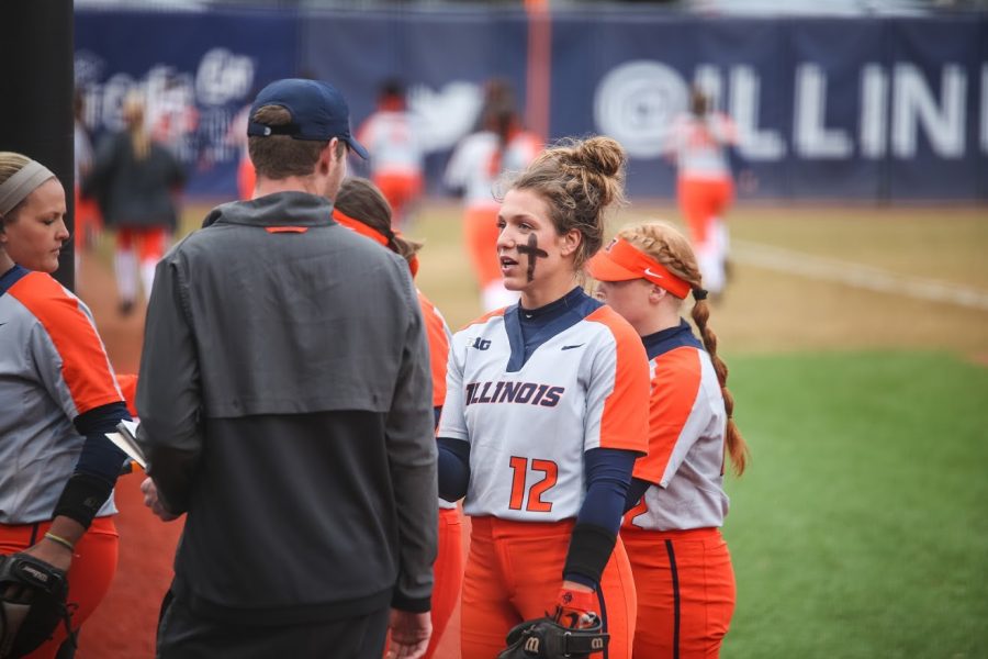 Taylor Edwards speaking to one of the Softball coaches at Eichelberger Field on April 3. The Illini defeated ISU 2-1.