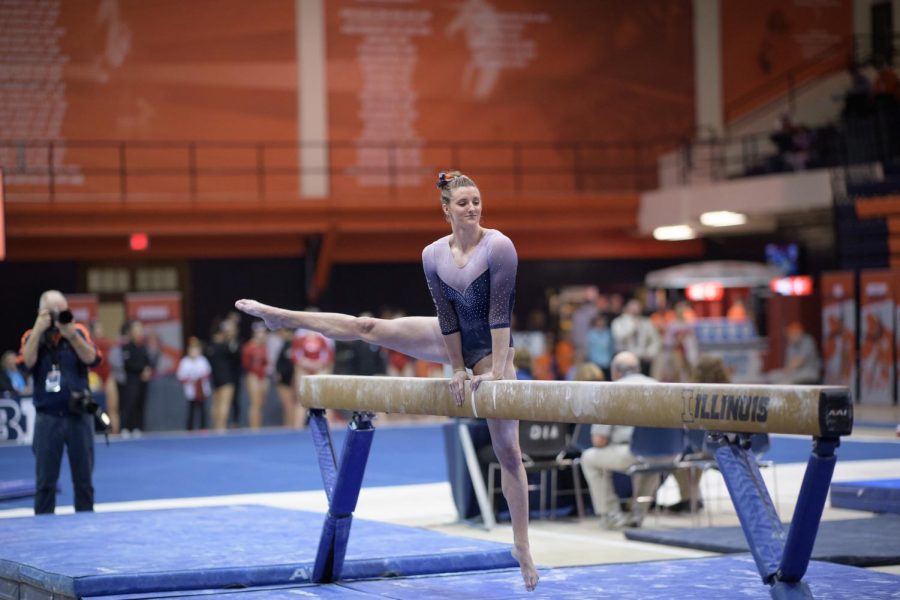 Mary Jane Otto performs on the balance beam at Huff Hall on March 9. The Illini finished second with a score of 196.075.