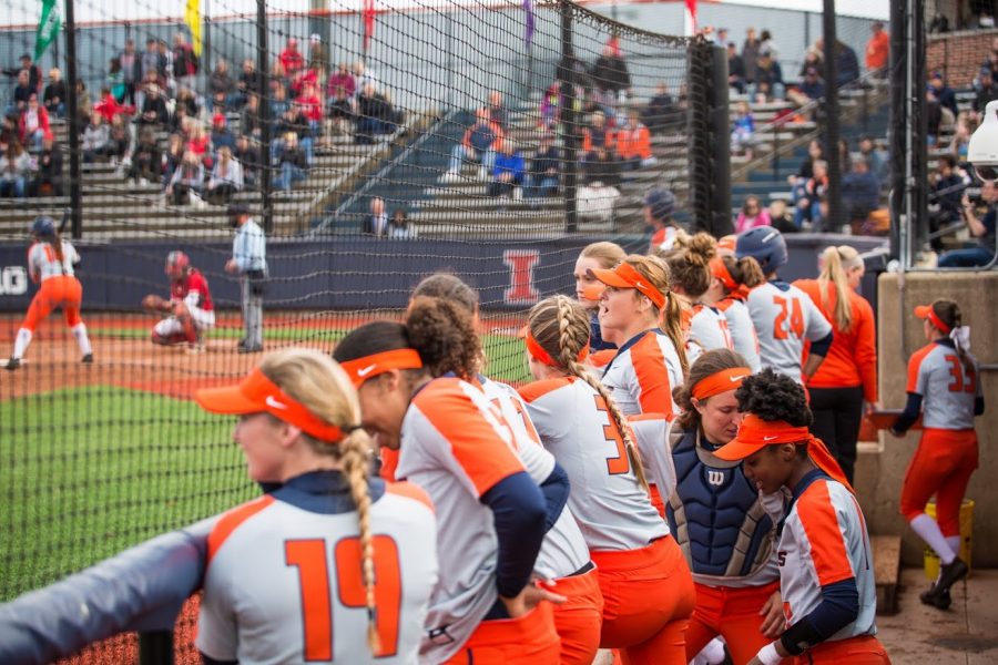 The Illini cheer on their batter in the dugout at Eichelberger Field April 3.  Illinois will be looking to secure a final series win against Purdue next weekend.