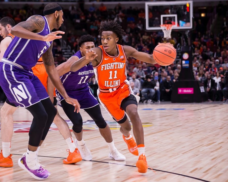 Illinois guard Ayo Dosunmu (11) dribbles around a defender during the game against Northwestern in the first round of the Big Ten Tournament at the United Center on Wednesday, March 13, 2019.
