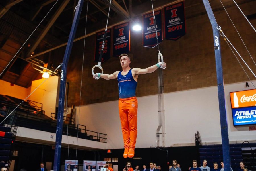 Max Diab performing on the rings at Huff Hall