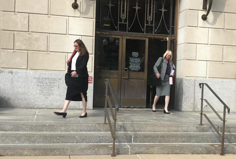 Members of Brendt Christensens defense team, Elisabeth Pollock (left) and Julie Brain (right) walk out of the courtroom on Monday. In order to avoid the death penalty for Christensen, the defense has been working on humanizing him for the jury, bringing up his struggles with mental health and how he was growing up. 