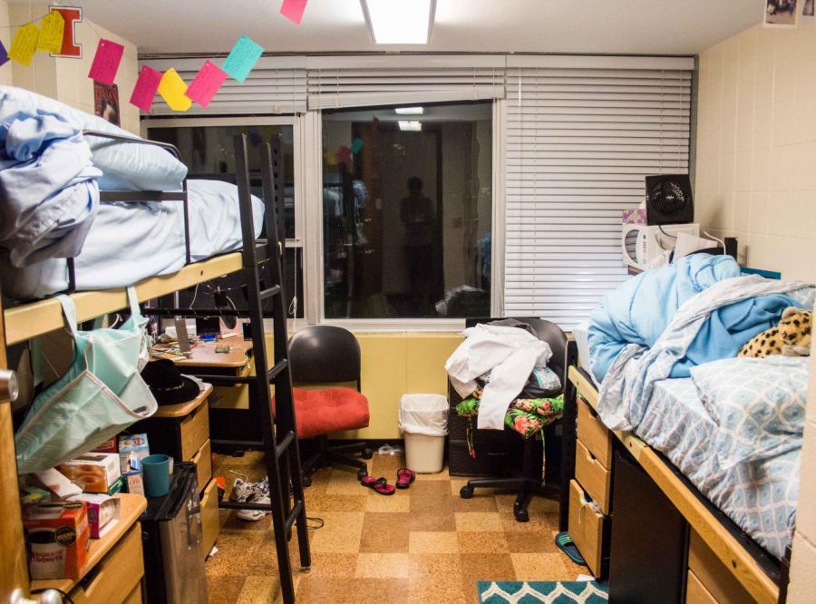 Decorations hang in a dorm room in Carr Hall of the Pennsylvania Avenue residence halls. Plants or posters can help you customize your tiny living space.
