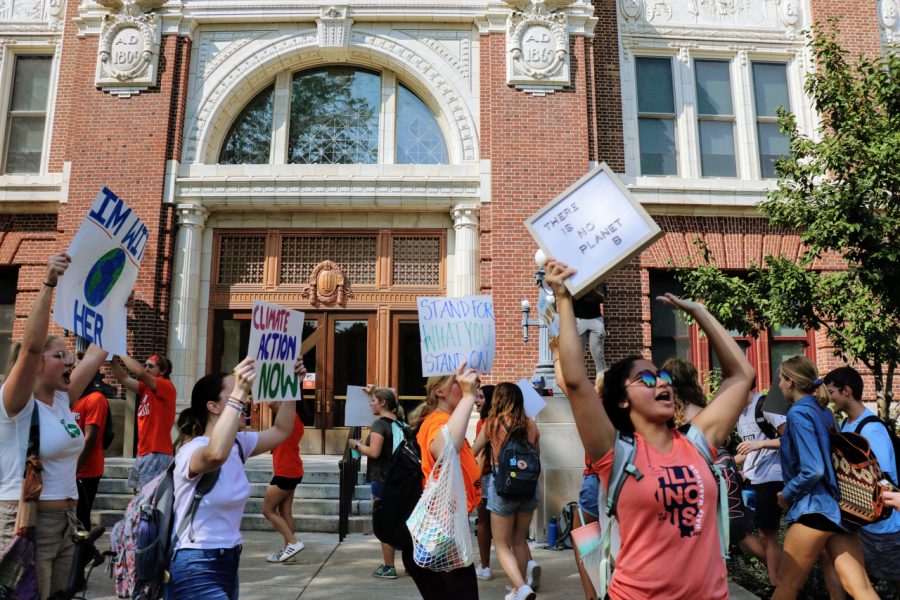 Protestors march and chant in front of Lincoln Hall on Sept. 21 for the Climate March.