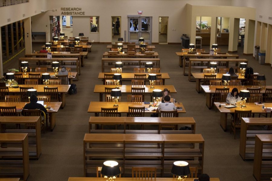 Students study in the College of Law Library on Friday. On Saturday, the Law School Admission Council administered the LSAT digitally using tablets, replacing the standard paper exam. 
