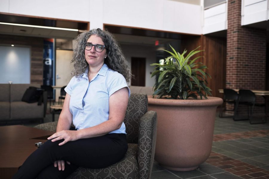 Professor Lauren Aronson sits in the main lobby of the Law Building on Sept. 12. Law Professors Aronson and Michael LeRoy believe Trump’s recent citizenship policy is the first step in ending birthright citizenship for children of unauthorized immigrants, a longtime goal of the Trump campaign.