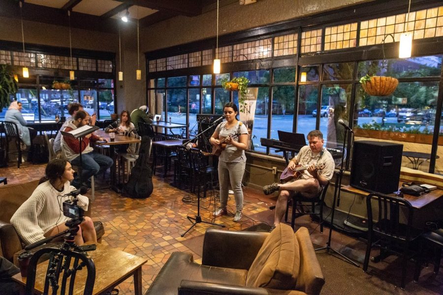 Madelyn Childress, freshman in FAA, and Matthew Childress performed during an open mic night at Espresso Royale on Sept. 5. The open mic community was forced to find a new spot after the Espresso Royale location on Daniel Street closed in May.
