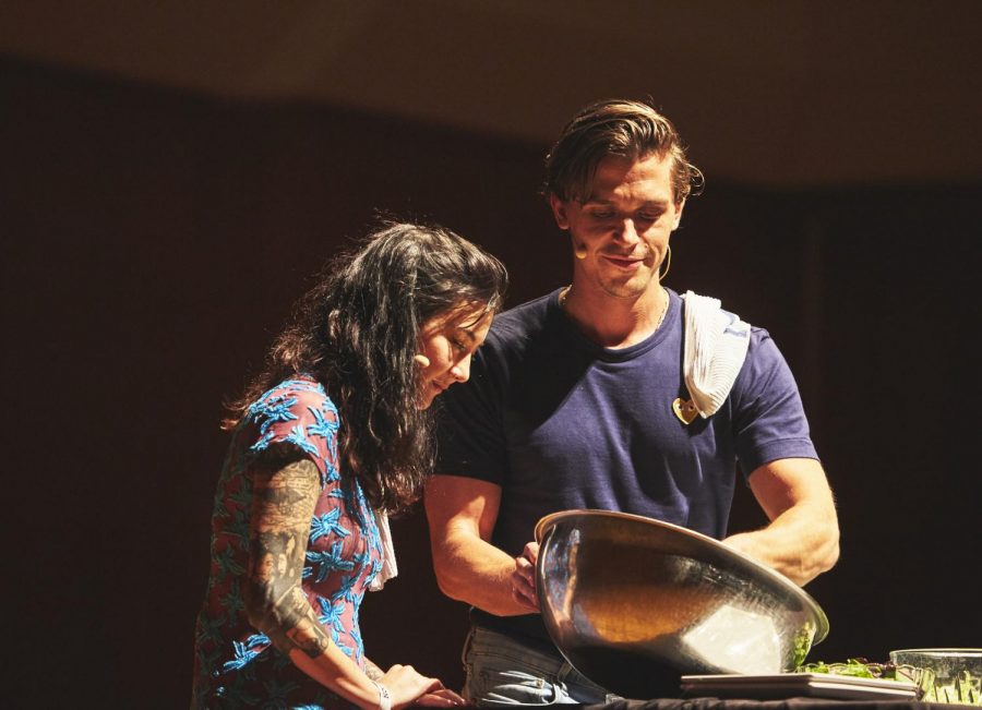 Antoni+Porowski+and+Michelle+Zauner+make+a+salad+during+a+cooking+demonstration.+Porowski+brought+his+expertise+to+the+Krannert+Center+for+the+Performing+Arts+on+Friday.