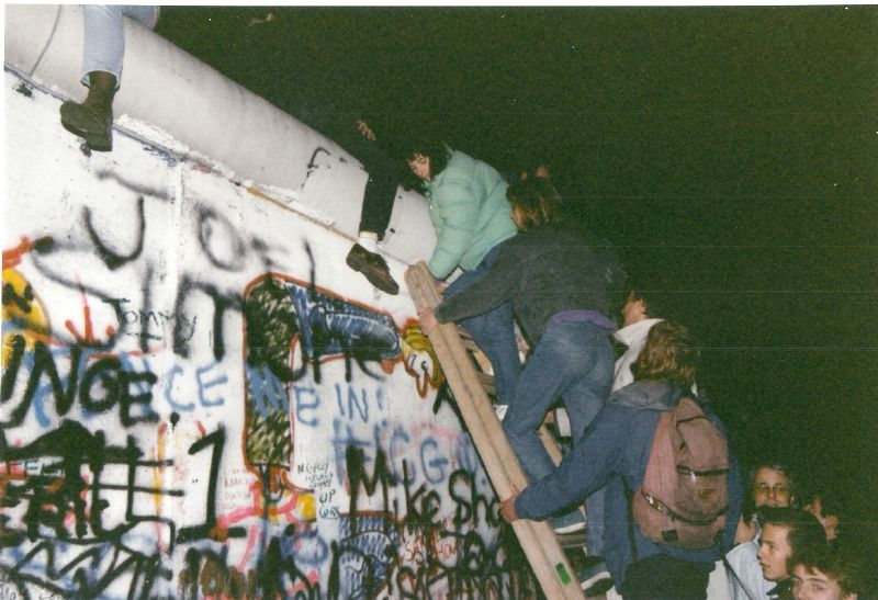 The Berlin Wall, a longtime symbol of socialism in Europe, falls in November 1989. Columnist Andrew outlines the dangers of misusing the term “socialism” in political spheres.
