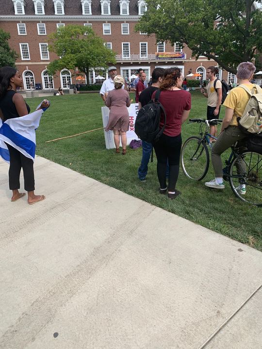 Counter-protestors confront an anti-Semitic speaker on the Main Quad Tuesday. Rabbi Ariel Naveh, a senior Jewish educator at Hillel said he wasn’t shocked by the speaker’s presence. Others also expressed disappointment and shock.