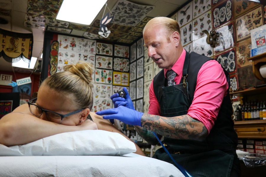Lunchbox tattoos Brenna Kelly, sophomore in Engineering, at New Life Tattoos on Sunday. Lunchbox believes tattoos are a way of self expression and have different meanings for everyone.